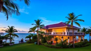 Phuket property management showcasing a beachfront villa with lush gardens and sunset lighting.
