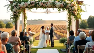 Couple celebrating their Clarksburg wedding under a floral arch with vineyard background.